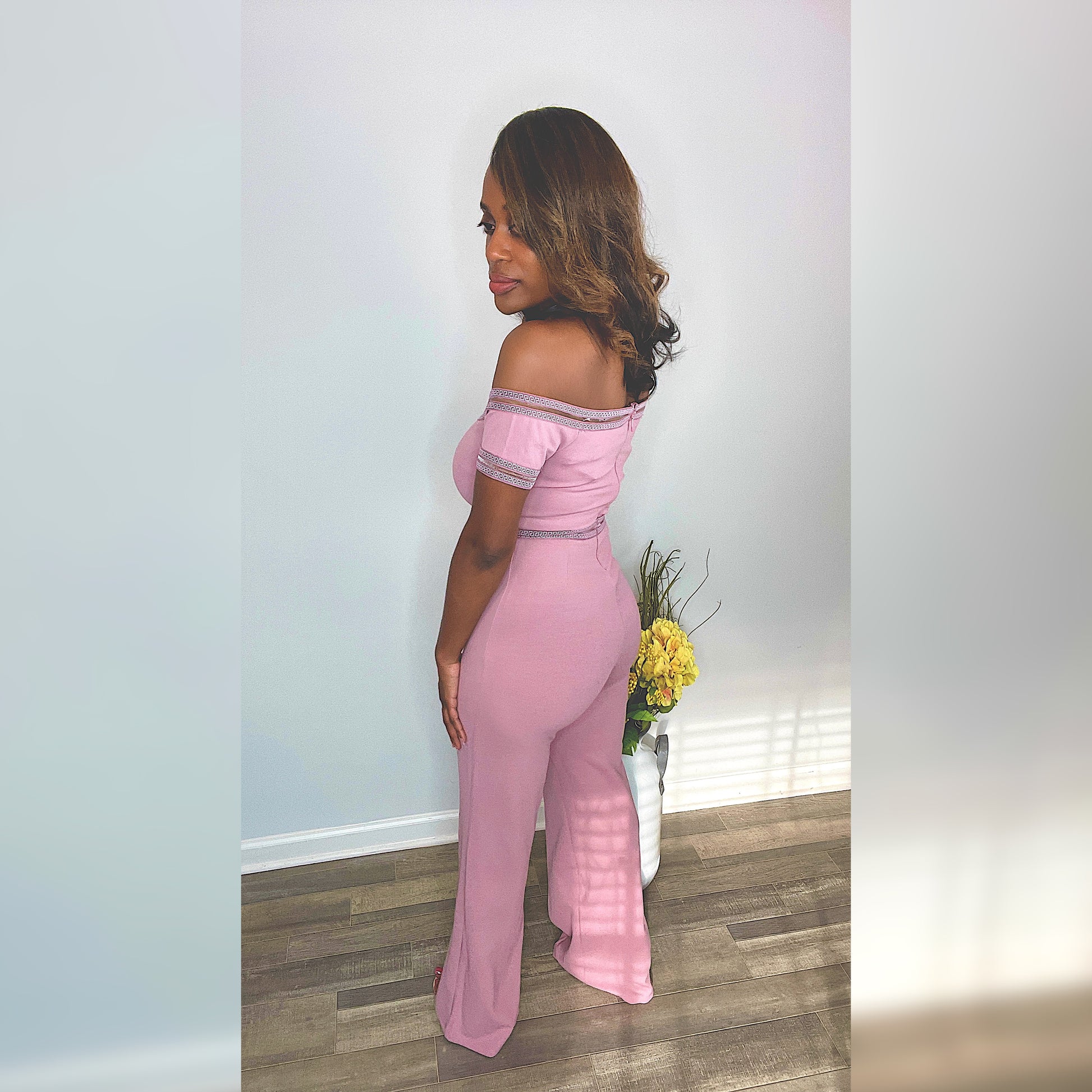 Forever Galore wearing a pink off the shoulder jumpsuit with Shoe Dazzle clear heels Wear on Valentine's Day or Breast Cancer Awareness month and Real Housewives of Atlanta 